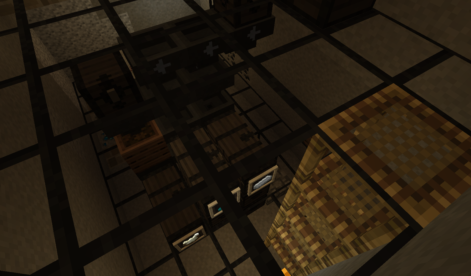 Screenshot of a contraption under some glass blocks. Scaffolding is shown to the right, allowing the player to descend below the glass blocks to access the chests attached to the sorting mechanism. The chests have item frames attached to them, showing the contents, which from left to right are bonemeal, glow ink sacs and iron.