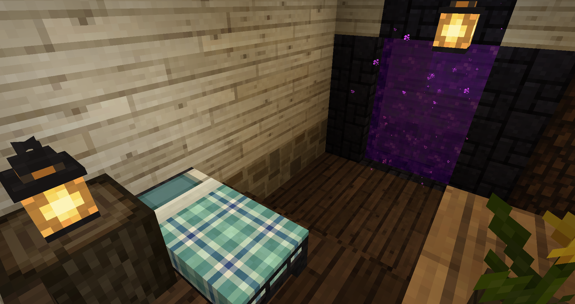 Screenshot of the interior of a Minecraft house. The viewer is standing on bookshelves in an alcove (I think this can be considered an alcove?) in the house, looking down at a bed with a lantern next to it. Facing the alcove is a Nether portal.